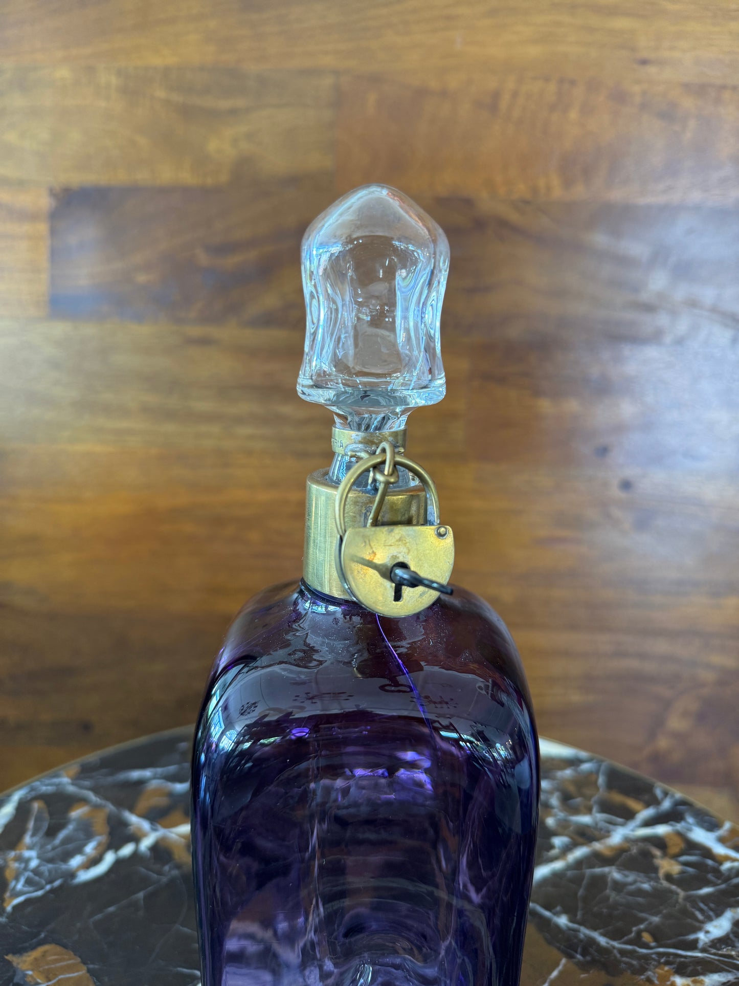 Rare vintage Austrian amethyst-glass decanter with brass padlock detail