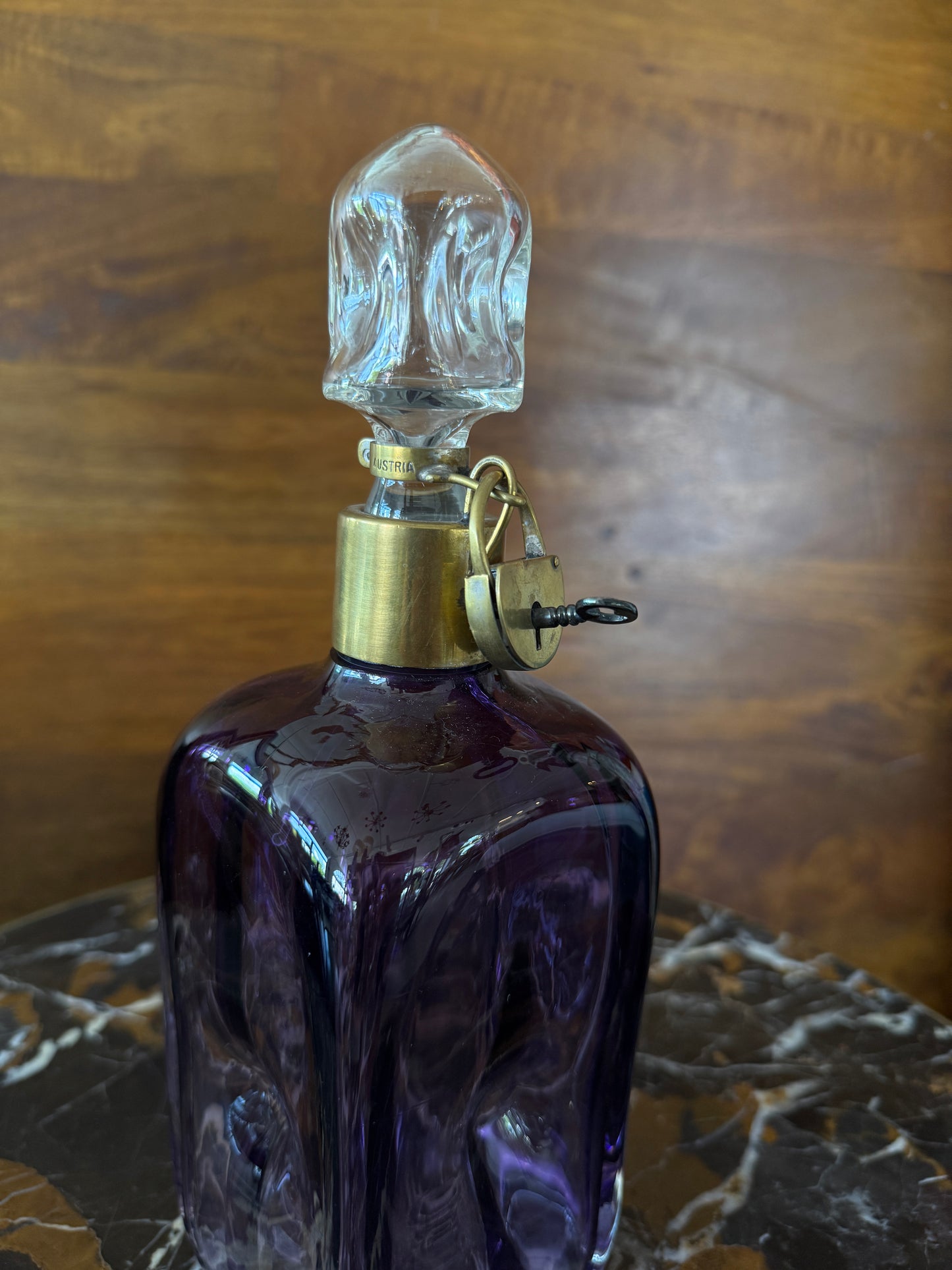 Rare vintage Austrian amethyst-glass decanter with brass padlock detail