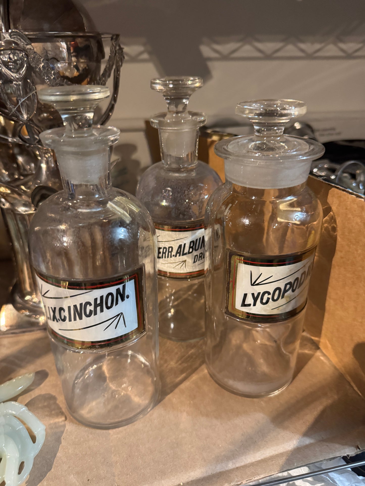 WHLSL A Set of Three Antique Apothecary Bottles